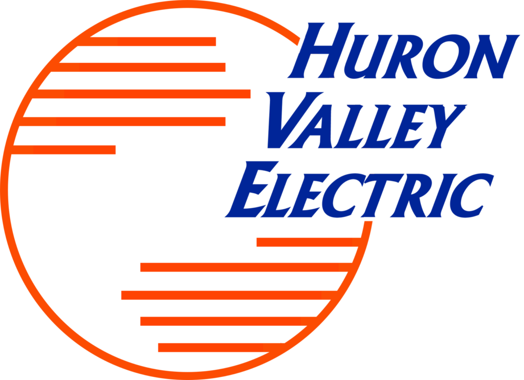 A logo features an orange background with a large white circle on the left, containing horizontal orange lines. The partially visible blue text reads Valley Electric. On the right, a blue shape cuts into the circle, reminiscent of designs from Willys Overland Lofts.